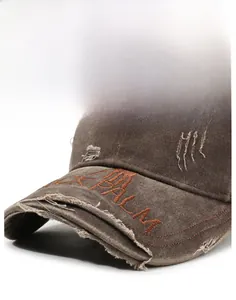 Close-up of distressed brim with PALM embroidery on vintage washed baseball cap