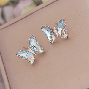 Elegant rose gold butterfly earrings with blue gradient crystal and micro pavé accents