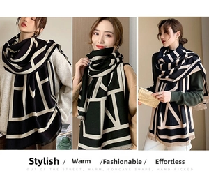 Close-up of minimalist geometric line pattern and fringe detail on warm thick scarf
