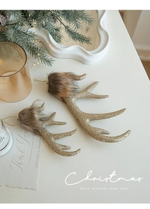 Detail of glitter gold reindeer antler ornaments with faux fur trim for Christmas tree