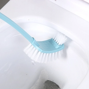 Wall-mounted long handle toilet brush with dual-sided bristles cleaning white ceramic bowl