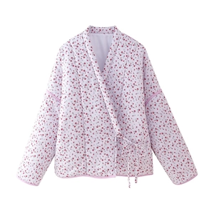 Detailed view of quilted lilac cotton jacket with red floral pattern and lace-up closure