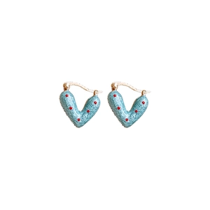 Polka dot blue heart earrings with golden metal clasps on a clean white background