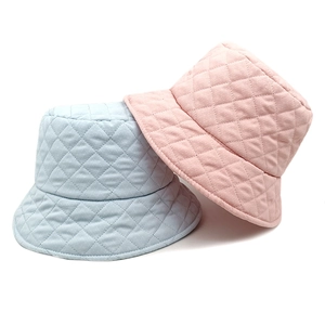 Quilted diamond lattice bucket hat for winter in light blue and pink fashion colors
