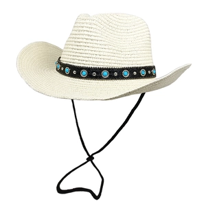 Close-up of cream straw cowboy hat with turquoise beads and adjustable chin strap
