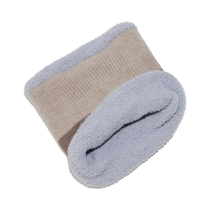 Detail of winter neck warmer featuring beige knit and soft light purple fleece lining