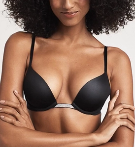 Detail shot of black push-up bra with rhinestone-embellished straps and satin finish