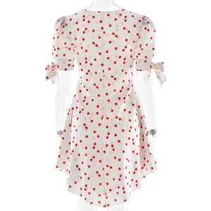 Vue arrière de la robe blanche à imprimé cerise avec zip invisible et nœuds aux manches