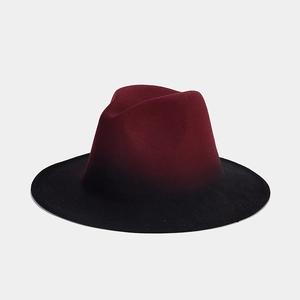 Macro detail of red and black gradient wool fedora hat with a wide brim for elegant styling