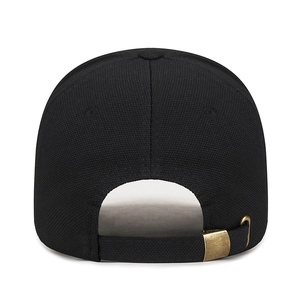 Adjustable black textured baseball cap with bronze metal buckle and 1986 embroidery detail