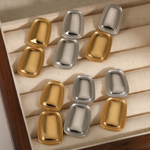 Set of minimalist geometric rectangular earrings in polished gold and silver finishes