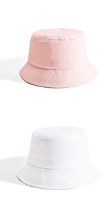 Detail of cotton bucket hats in pink and white with fine stitching on the brim