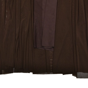Macro shot of dark brown ruched mesh fabric detailing the dress texture and inner lining