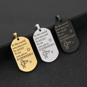 Detailed view of gold, silver, and black stainless steel dog tags for Father's Day