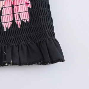 Floral print square neck top with smocked waist and ruffle hem details in black