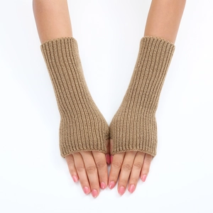 Detailed knit texture of beige striped arm warmers featuring a fingerless thumb hole design