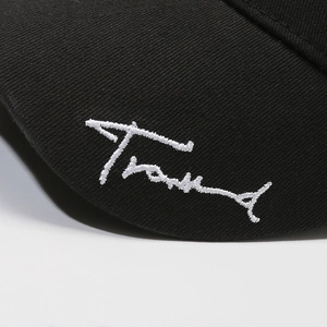 Black cotton baseball cap with white Trend embroidery, casual outdoor sun hat style