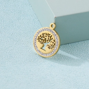 Gold Tree of Life pendant with white cubic zirconia crystals on a blue background