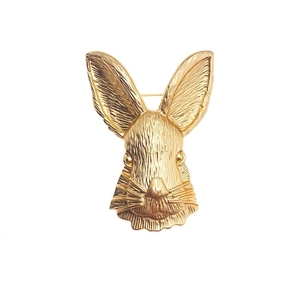 Vintage golden rabbit head brooch with brushed metal texture and safety pin backing