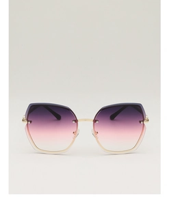 Detail of rimless sunglasses with purple to pink gradient lenses and gold metal frame
