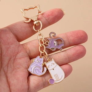 Cute cartoon cat paw and kitty keychains with gold metal finish and enamel charms