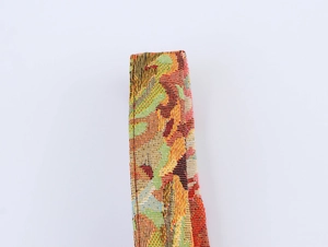 Close-up detail of multi-color woven fabric pattern on French vintage style sleeveless dress