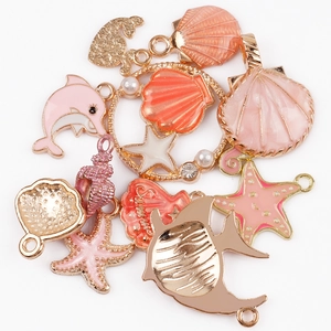 Pink enamel ocean charms in dolphin and starfish shapes for DIY jewelry making
