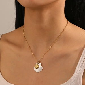 Minimalist stainless steel shell necklace with gold starfish and turtle charms on model