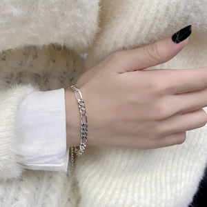 Minimalist 925 sterling silver Figaro chain bracelet with adjustable lobster clasp on wrist