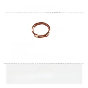 Detailed view of dark brown leather belt with rose gold alloy buckle and dimensions