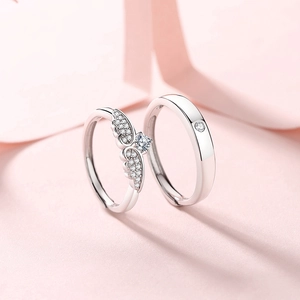 Cupid's wings S925 sterling silver couple rings set with zircons on pink background