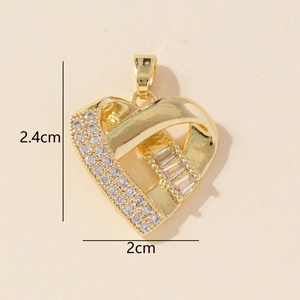 Detail of gold heart pendant with cubic zirconia stones showing 2.4cm by 2cm dimensions