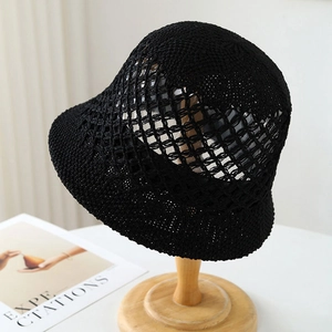 Elegant black crochet straw bucket hat with breathable mesh design for sun protection