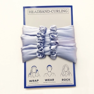 Detail of lavender satin heatless hair curler set with instructions and scrunchies