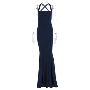 Detail of navy blue mermaid dress featuring halter neck and crossover strap design