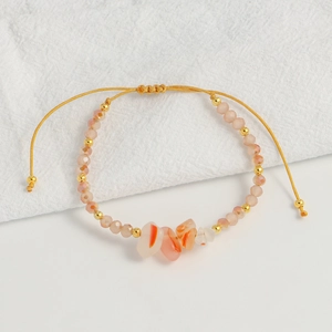 Detail of bohemian agate bead bracelet with adjustable gold cord and natural stones