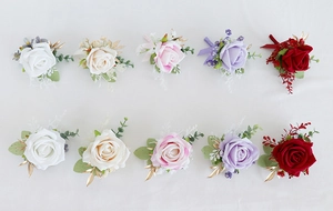 Detailed close-up of artificial rose corsages and wrist flowers in multiple colors