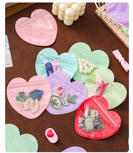 Macro detail of heart-shaped macaron resealable bags for jewelry and small gift storage