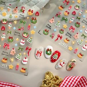 3D embossed Christmas nail stickers with snowman and bow designs on festive background