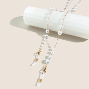 Detail view of gradient pearl eyewear chain with golden lobster clasps and silicone loops