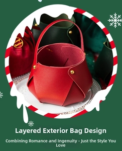 Detail of red leather Christmas apple gift bag with gold rivets and handle