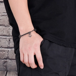Men's punk anchor chain bracelet in black stainless steel worn on a male wrist