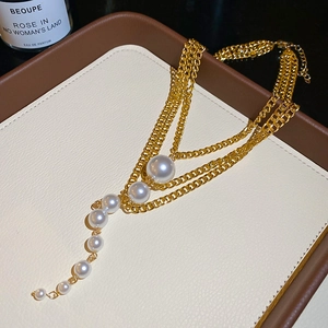 Elegant multi-layer gold chain necklace with gradient faux pearls and tassel design