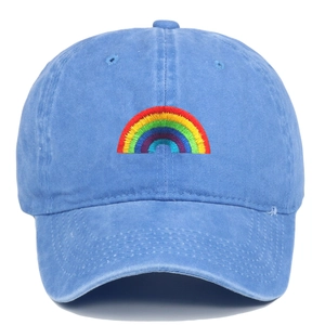 Sky blue washed cotton baseball cap featuring rainbow embroidery on a clean white background