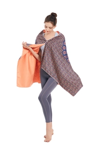 Microfiber beach towel detail showing bohemian blue pattern and vibrant orange lining