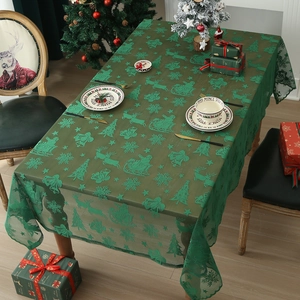 Green Christmas lace tablecloth featuring reindeer and snowflake patterns for party decor