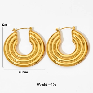 Detail view of gold chunky hoop earrings showing 42mm size and grooved texture design