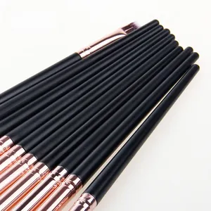 Detail of professional black and rose gold makeup brush set with matte handles
