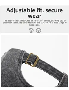 Detail of adjustable brass buckle on grey washed cotton baseball cap with fabric texture