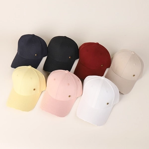 Detailed flat lay of distressed cotton baseball caps in seven assorted vintage colors
